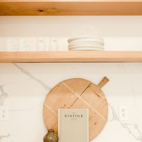 how to decorate floating shelves in a kitchen